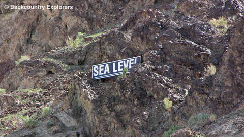 Sea level sign on side of the mountain